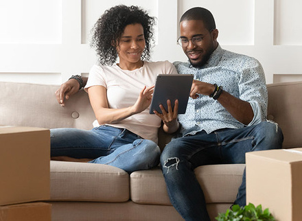 couple-moving-boxes-sofa.jpg